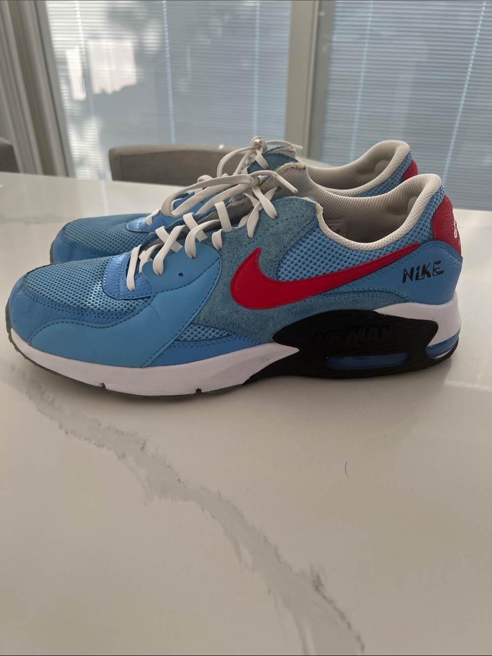 Nike Light Blue Athletic Sneakers with Red Swoosh
